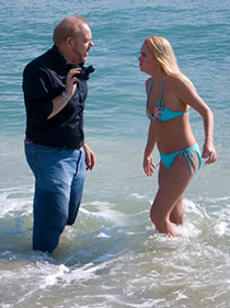 Kevin works with a model on location.
